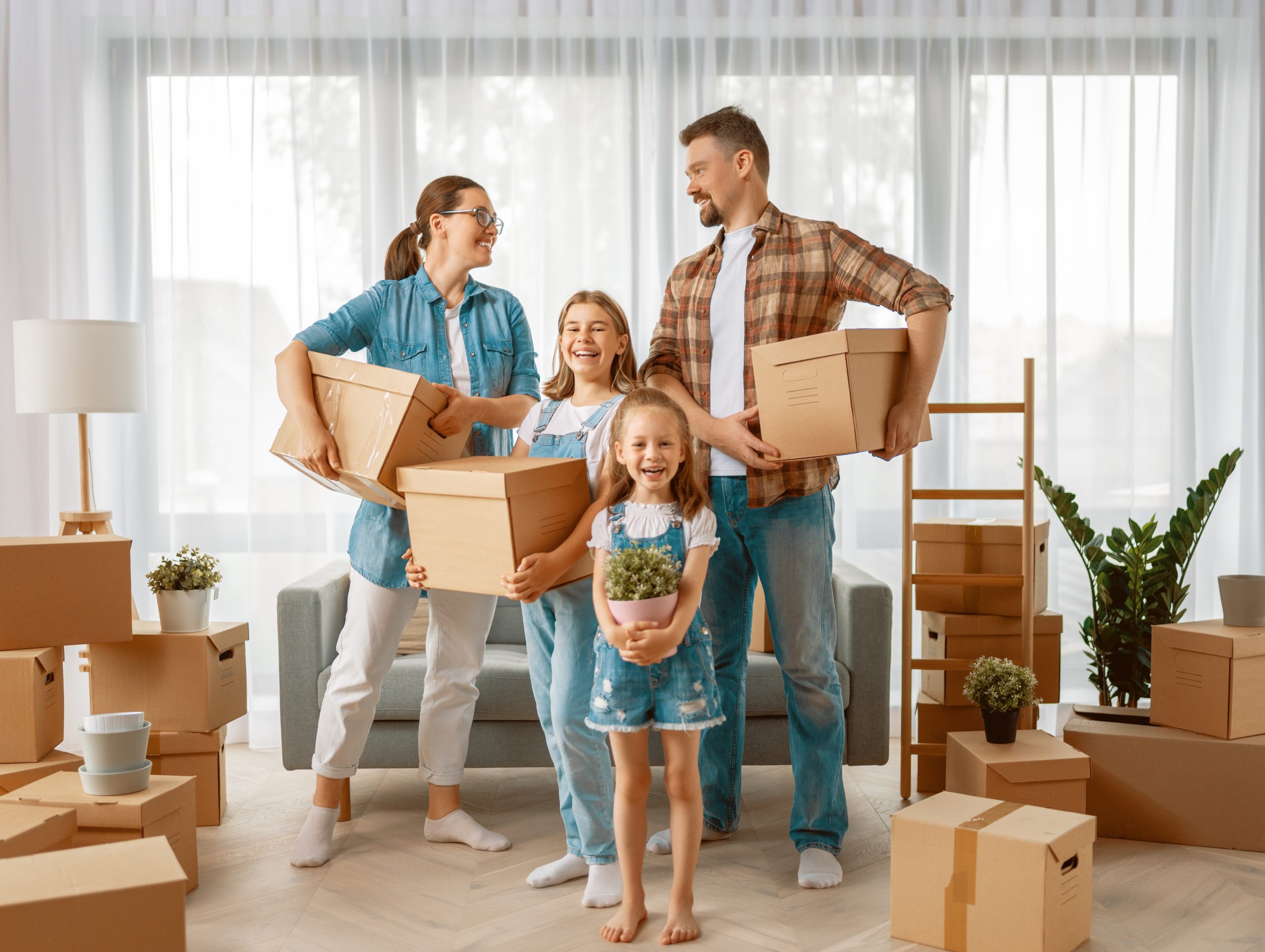 young family moving into new home together